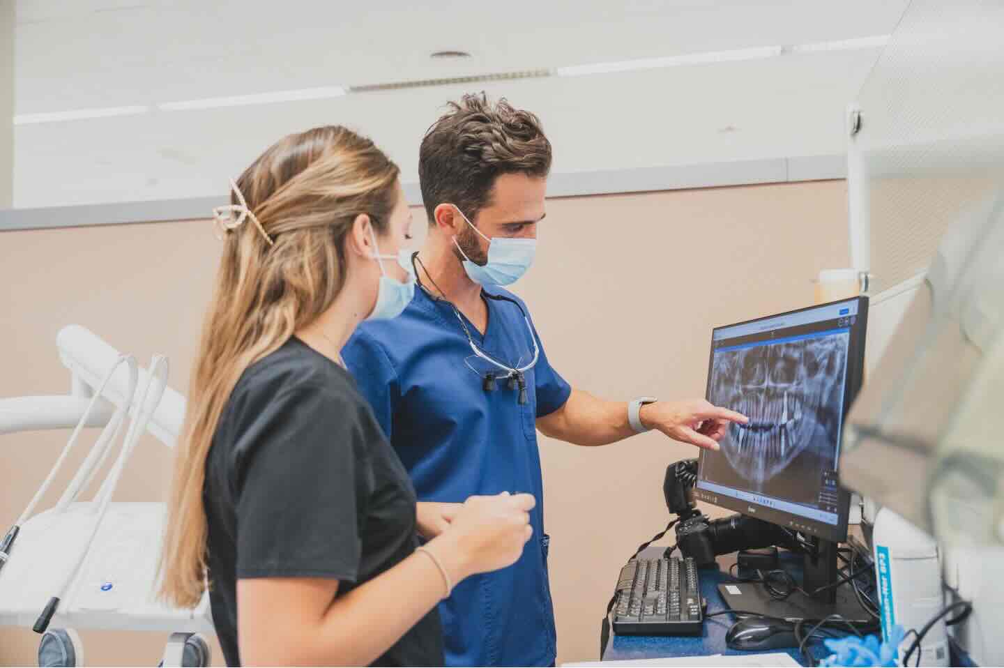 Dr. David Madruga reviewing dental scans with colleague
